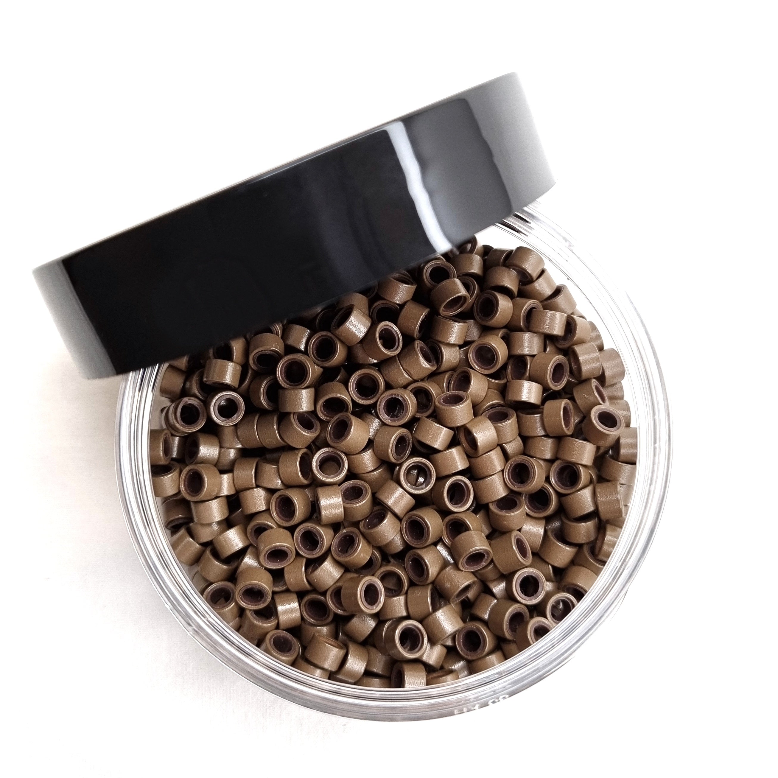 Salon professional silicon lined aluminium Light Brown micro beads used as an anchor for weave hair extensions. The silicone lining provides extra grip and acts as a soft, protective layer between the bead and natural hair.