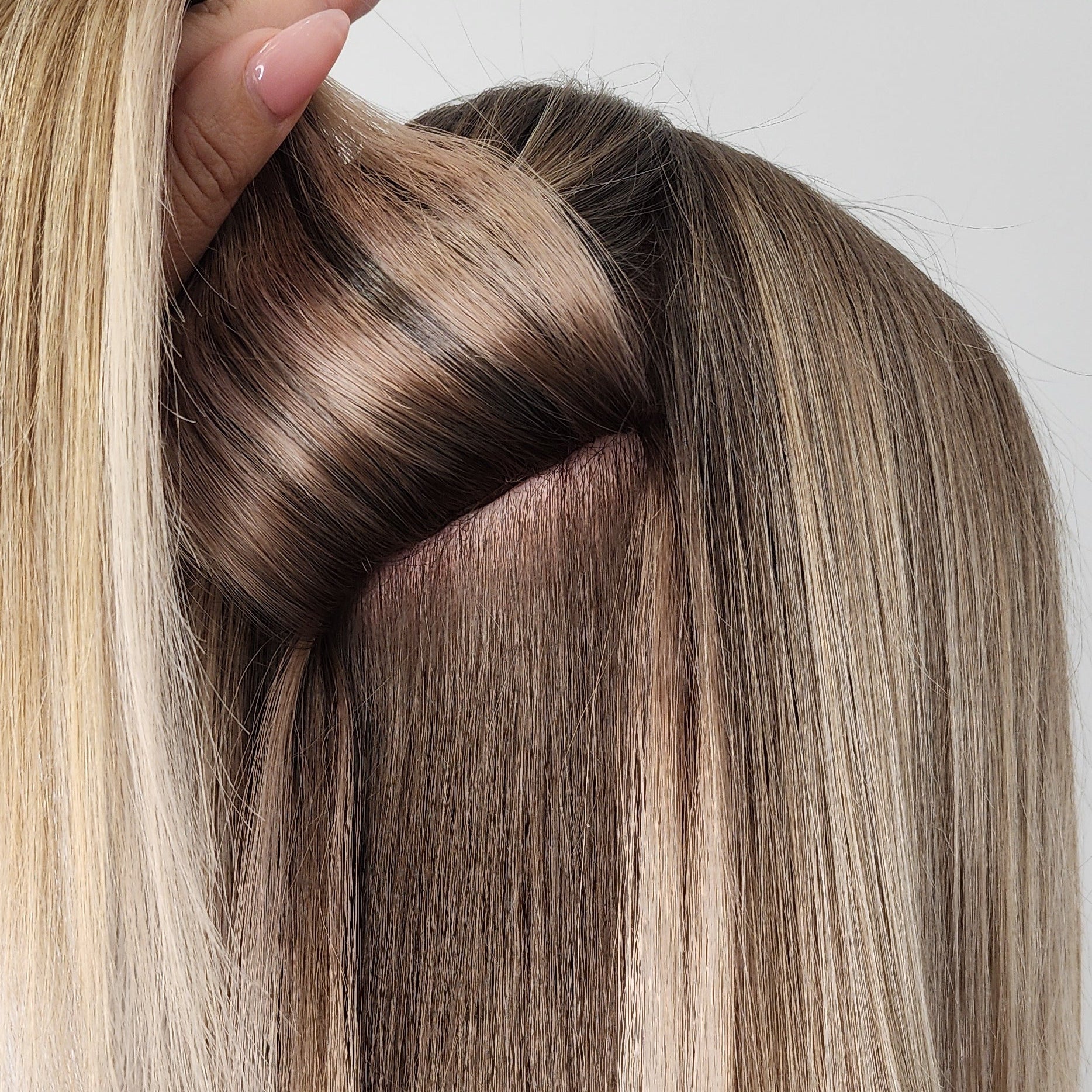Hailie Hair close up of Genius Weft Hair Extensions. Hidden beads and attachments.