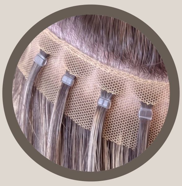 Hailie hair mesh integration hair extensions are a semi-permanent hair replacement system designed for individuals with hair thinning or partial hair loss. A breathable, hypoallergenic mesh is secured to the scalp, and natural hair is pulled through to seamlessly blend with weft extensions or closures.
