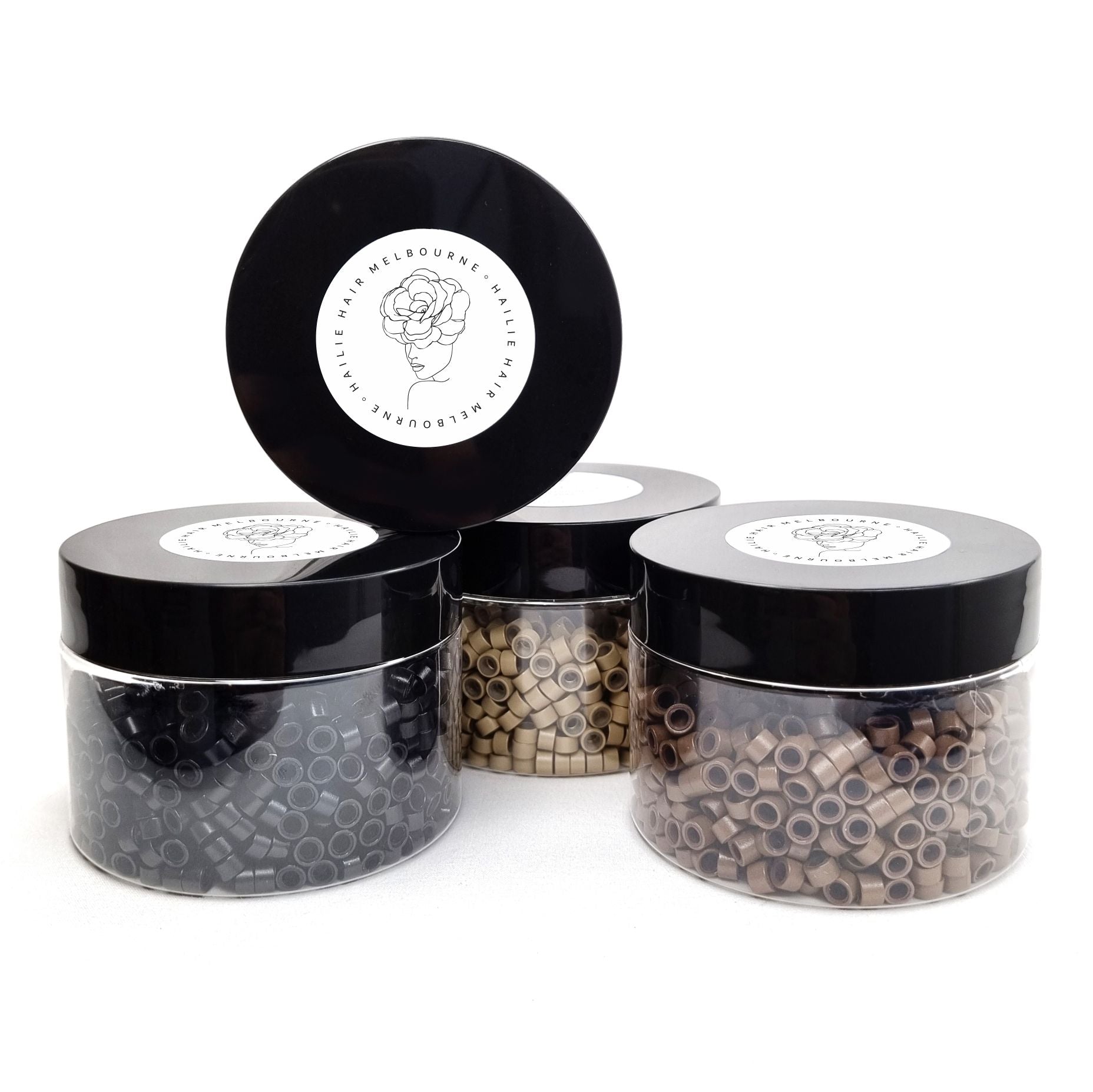 Salon professional silicon lined aluminium micro beads used as an anchor for weave hair extensions. The silicone lining provides extra grip and acts as a soft, protective layer between the bead and natural hair.